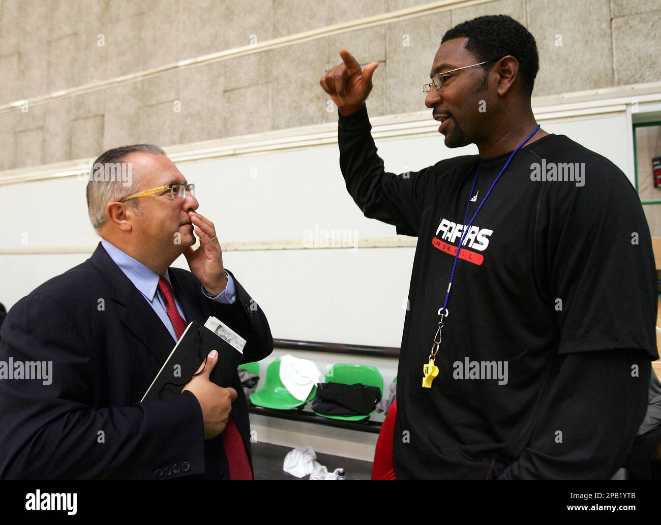 Toronto Raptors Vice-President Maurizio Gherardini of Italy, left, shares a word with coach Sam Mitchell at the end of a training session at "La Ghirada" in Treviso, Italy, Monday, Oct. 1, 2007. Toronto Raptors will play Boston Celtics in Rome on Oct. 6, 2007, part of an NBA Europe Live Tour.(AP Photo/Franco Debernardi) Stock Photo