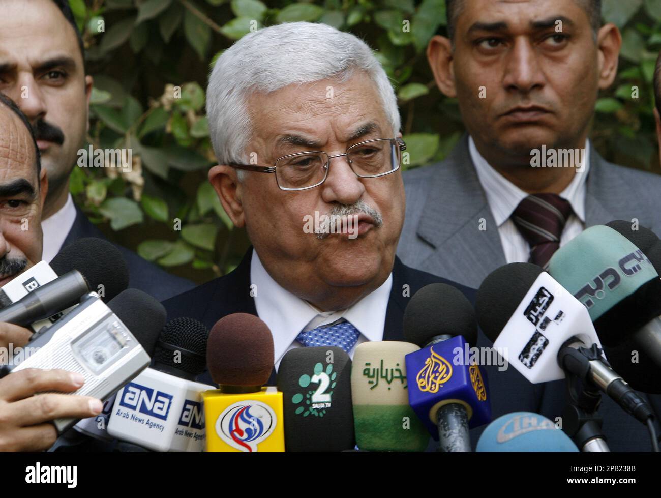Palestinian Authority President Mahmoud Abbas talks to reporters after
