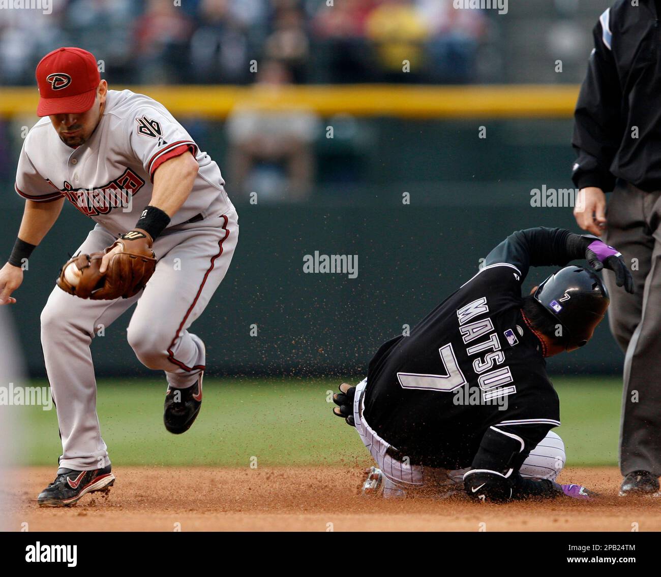 Colorado Rockies' Kazuo Matsui, right, gets a thumbs up from