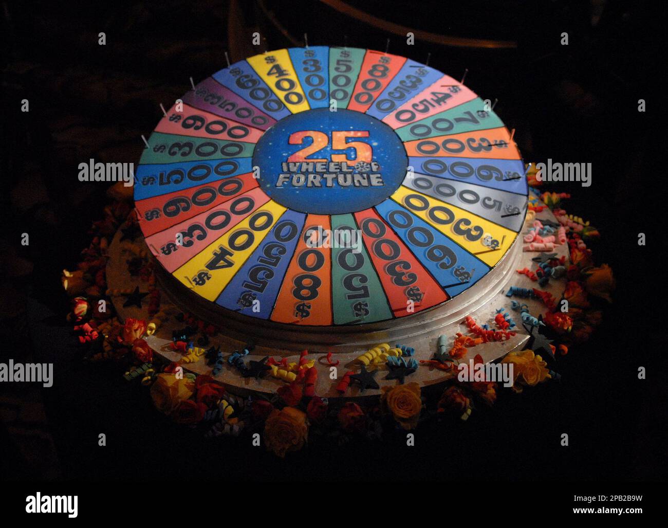 A wheelshaped cake is seen at the 25th anniversary of "Wheel of Fortune" sponsored by People