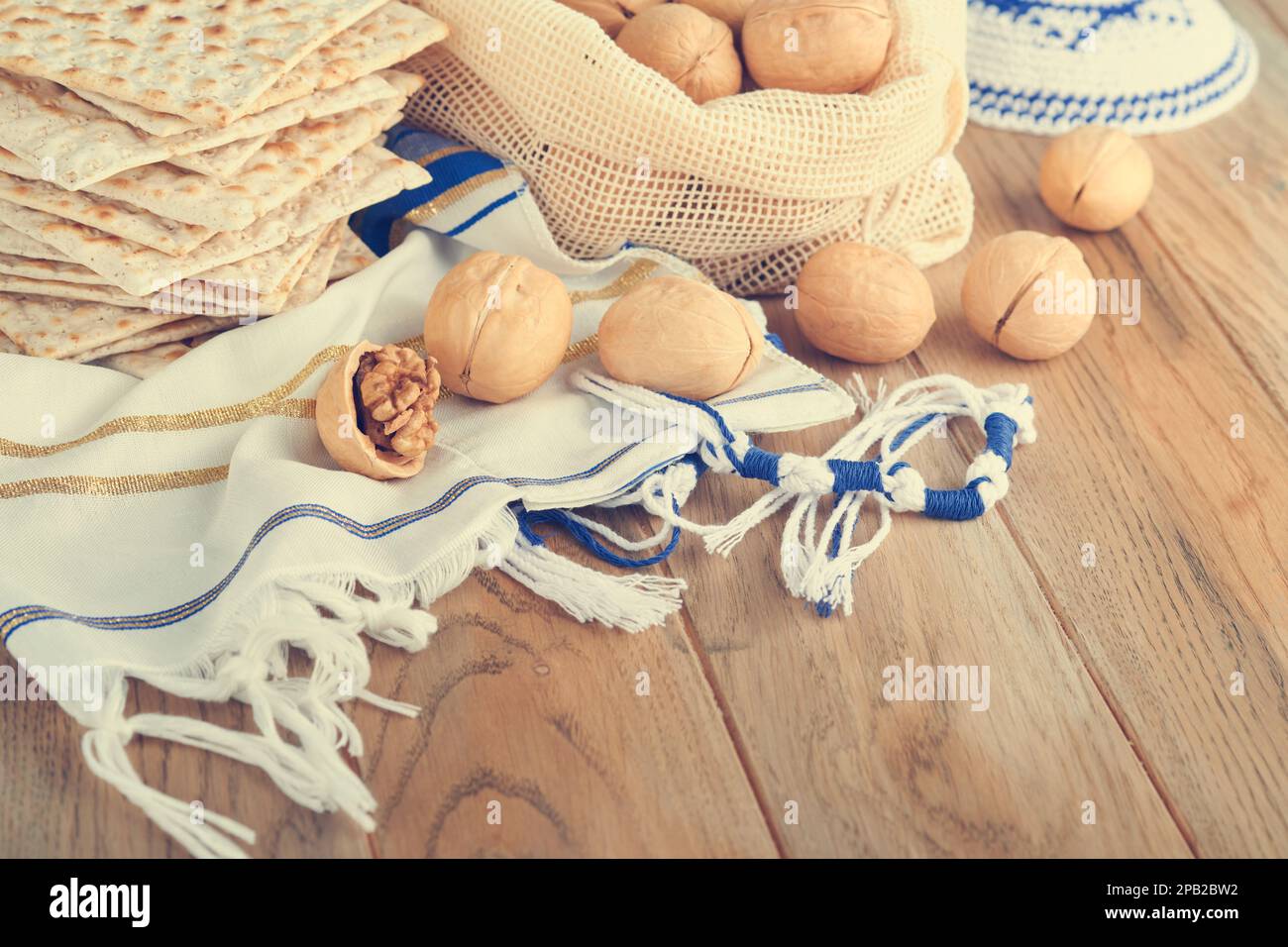 Passover celebration concept. Matzah, red kosher and walnut