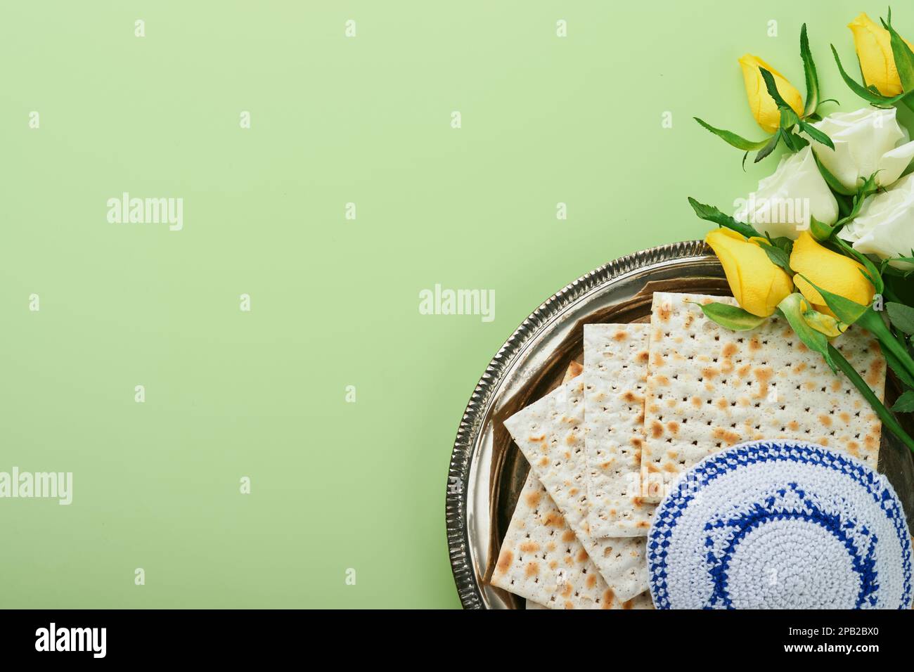 Passover celebration concept. Matzah, kosher red wine, walnut and