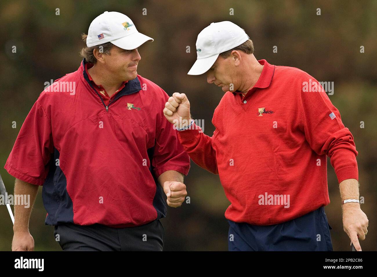 United States team members Phil Mickelson, left, and Woody Austin