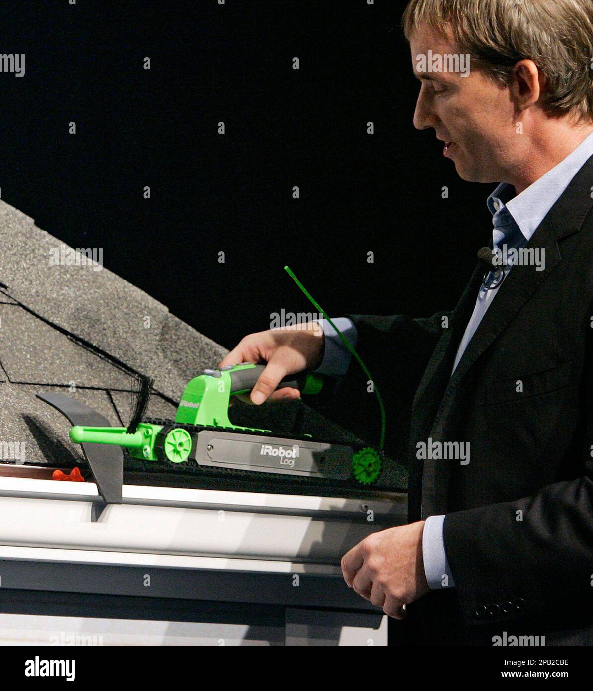 Colin Angle, iRobot co-founder and CEO, demonstrates his company's new iRobot  Looj Gutter Cleaning robot during a presentation at the Digial Life trade  show at New York's Javits Convention Center, Thursday, Sept.