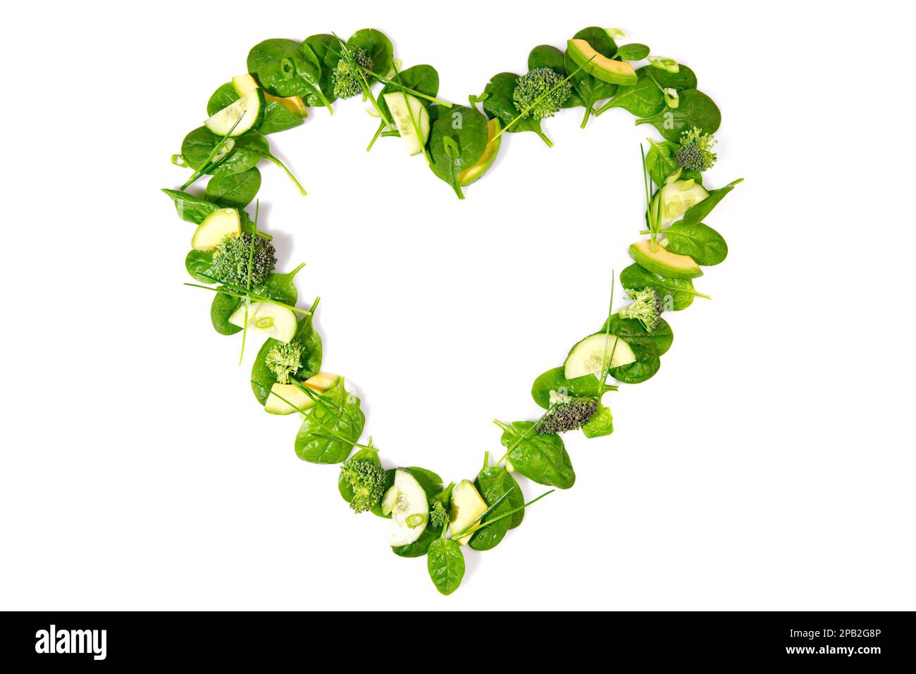 Heart Shape green Detox Salad and Vegetables isolated on white Background Stock Photo