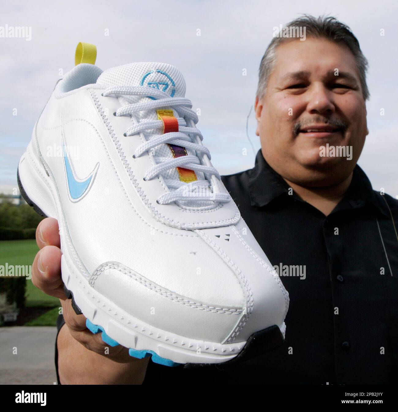 Pidgin roman voks Sam McCracken, manager of Nike's Native American business program, shows  the new Nike Air Native N7 shoe at Nike headquarters in Beaverton, Ore.,  Tuesday, Sept. 25, 2007. Nike unveiled the new shoe