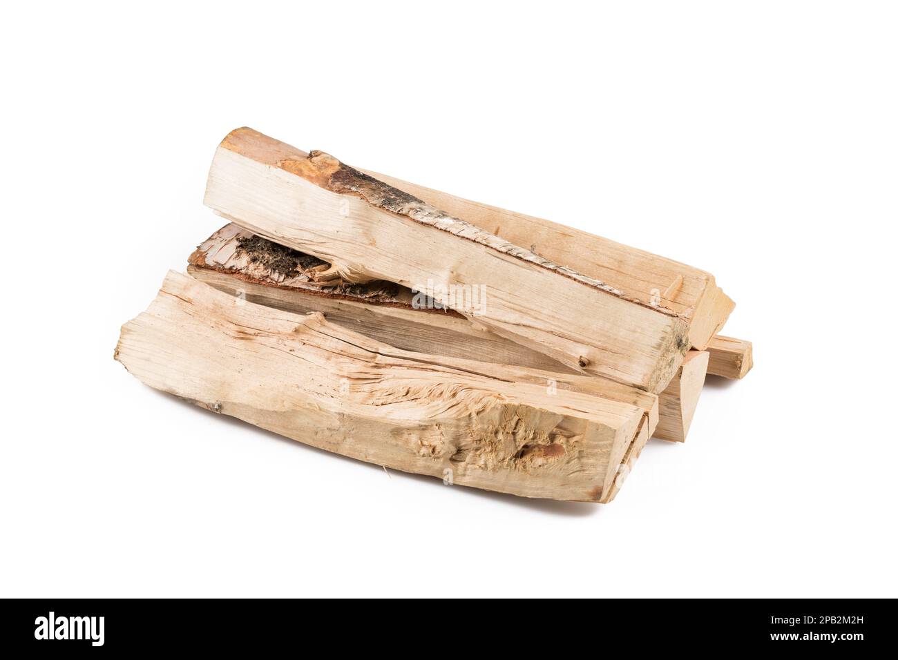 Stack of cut logs firewood from silver birch tree isolated on white