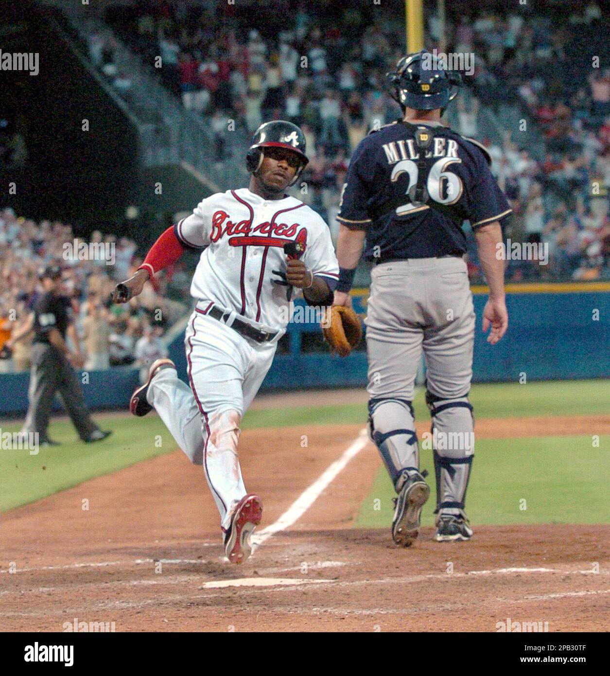 Washington Nationals' Felipe Lopez is tagged out trying to steal third base  by Atlanta Braves third baseman Chipper Jones in the fifth inning of a  baseball game Wednesday, April 11, 2007, in