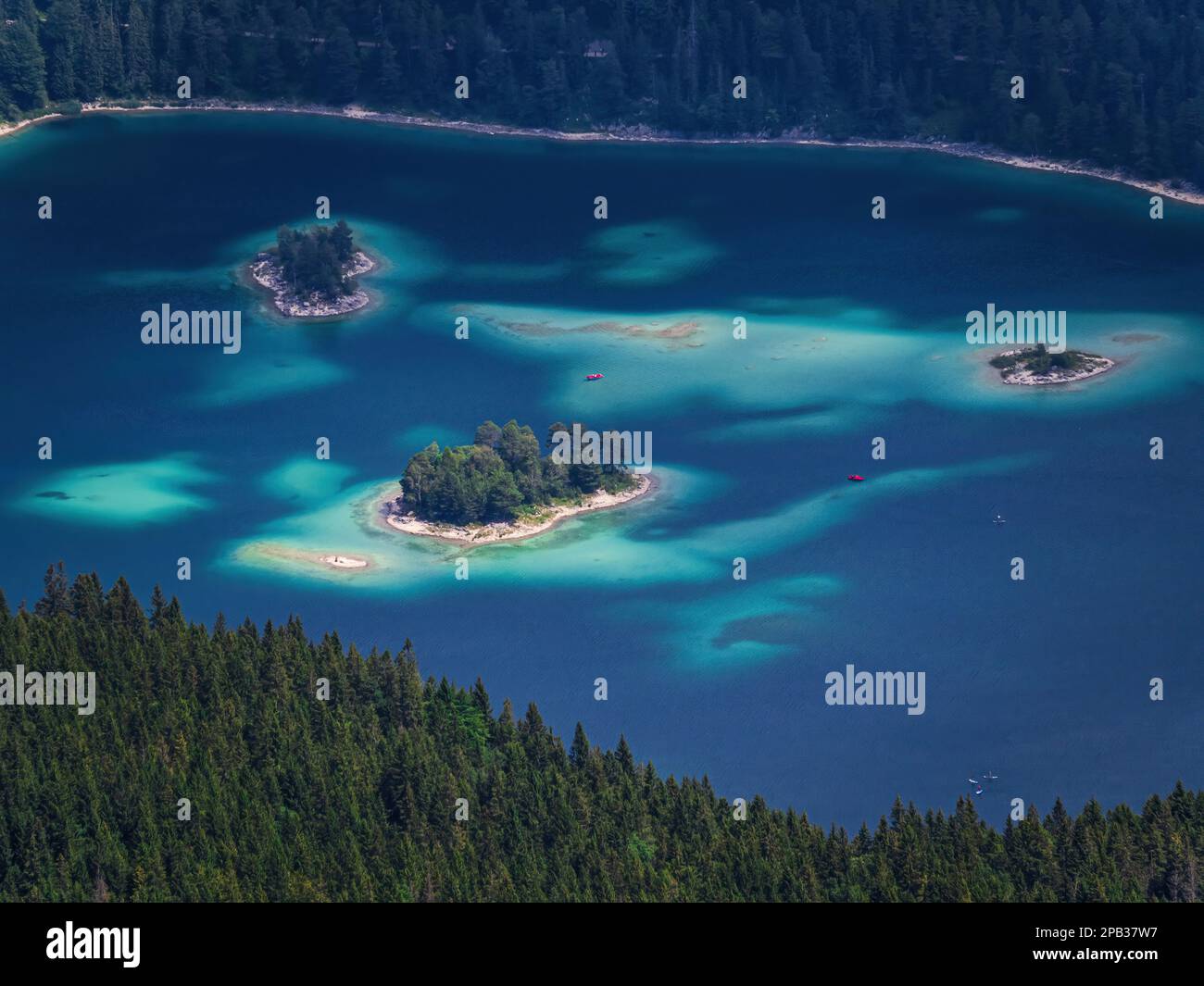 People kayaking canoeing on the lake sea Eibsee, Bavaria, Germany ...