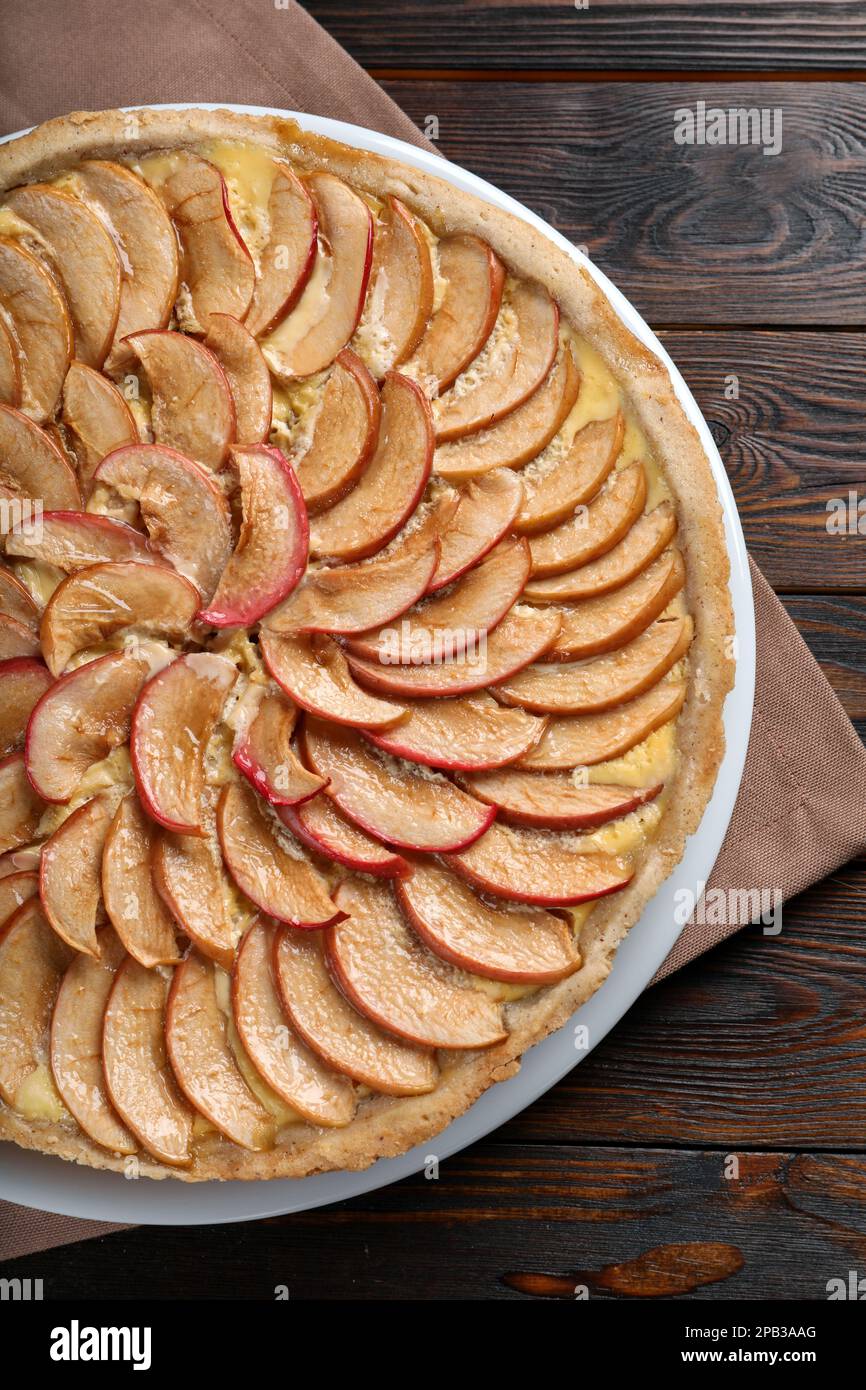 Freshly baked delicious apple pie on wooden table, top view Stock Photo