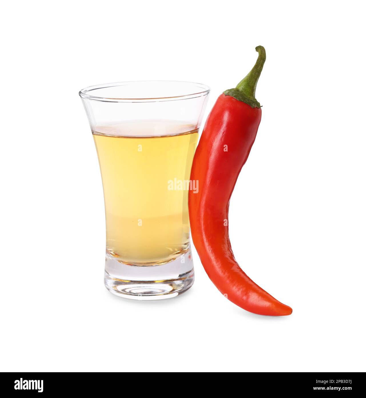 Red hot chili pepper and vodka in shot glass on white background Stock