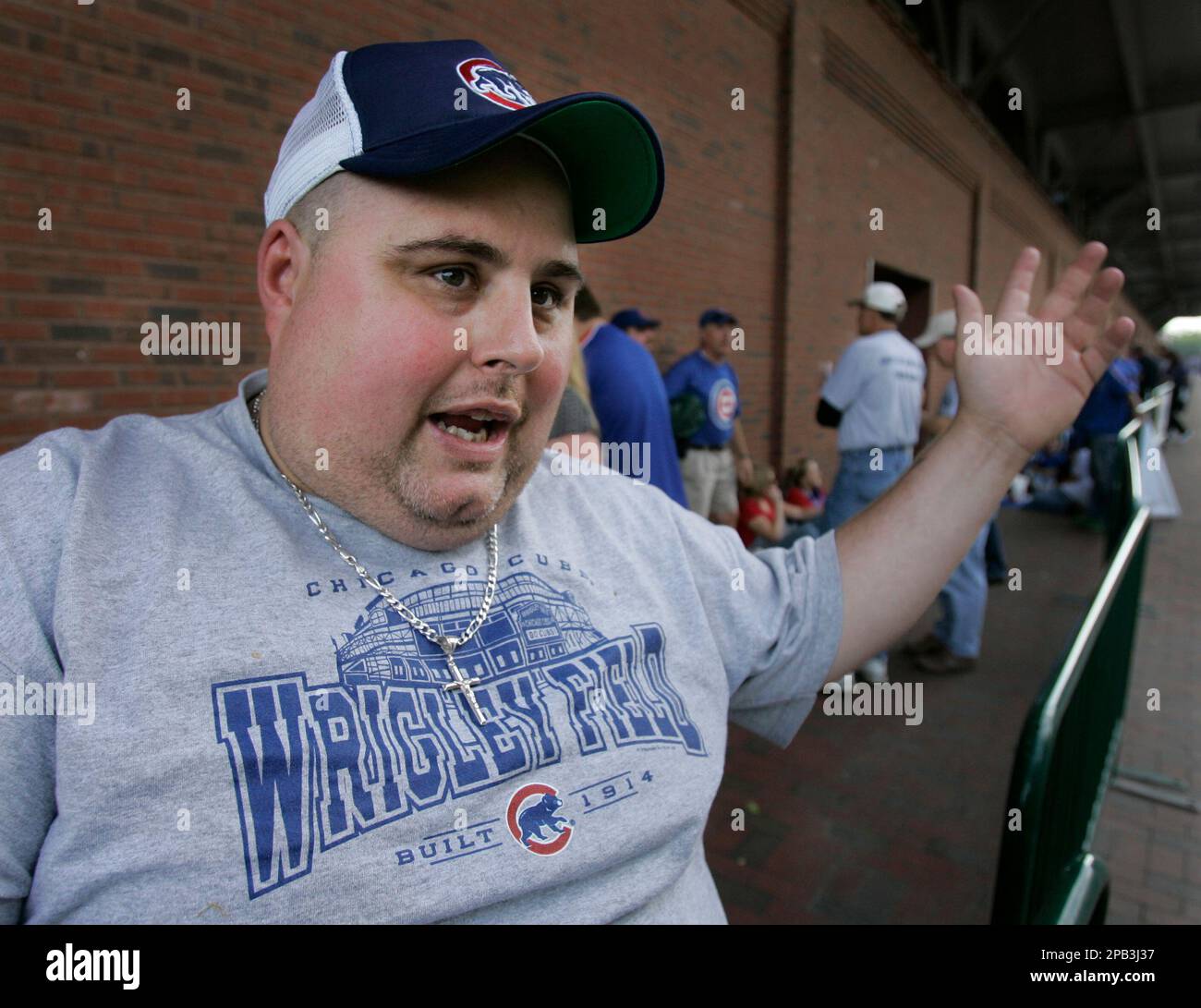 Patrick Butcher, a 38-year-old Chicagoan, waits outside Wrigley Field for  bleacher seats before the Cubs Reds game in Chicago, Monday, Sept. 17,  2007. Butcher worries some fan might play a role in