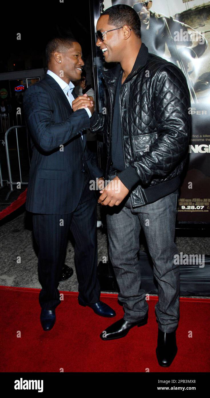 Actor Jamie Foxx, left, and actor Will Smith, right, pose on the press