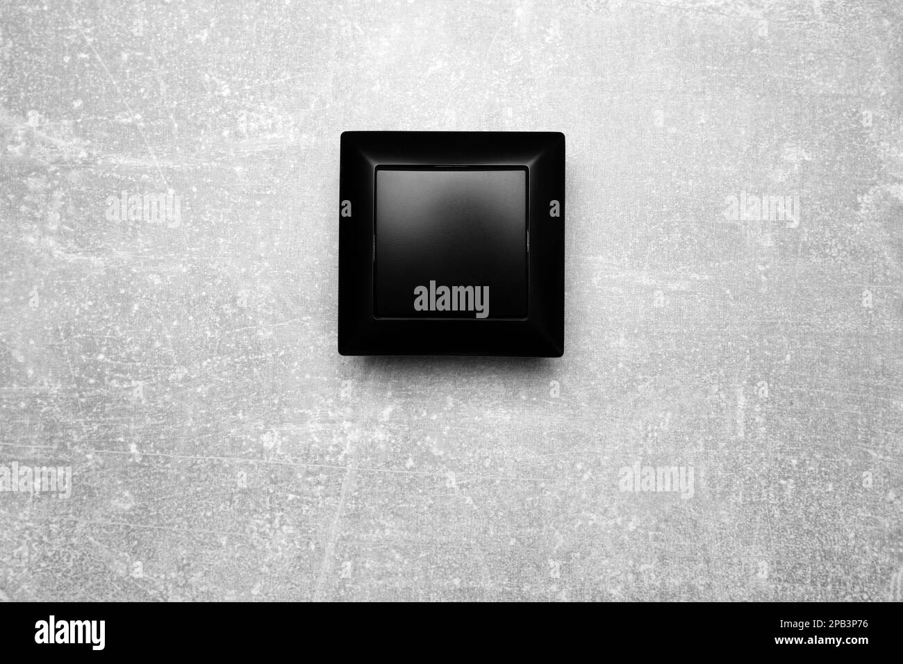 Black light switch on grey background, top view Stock Photo