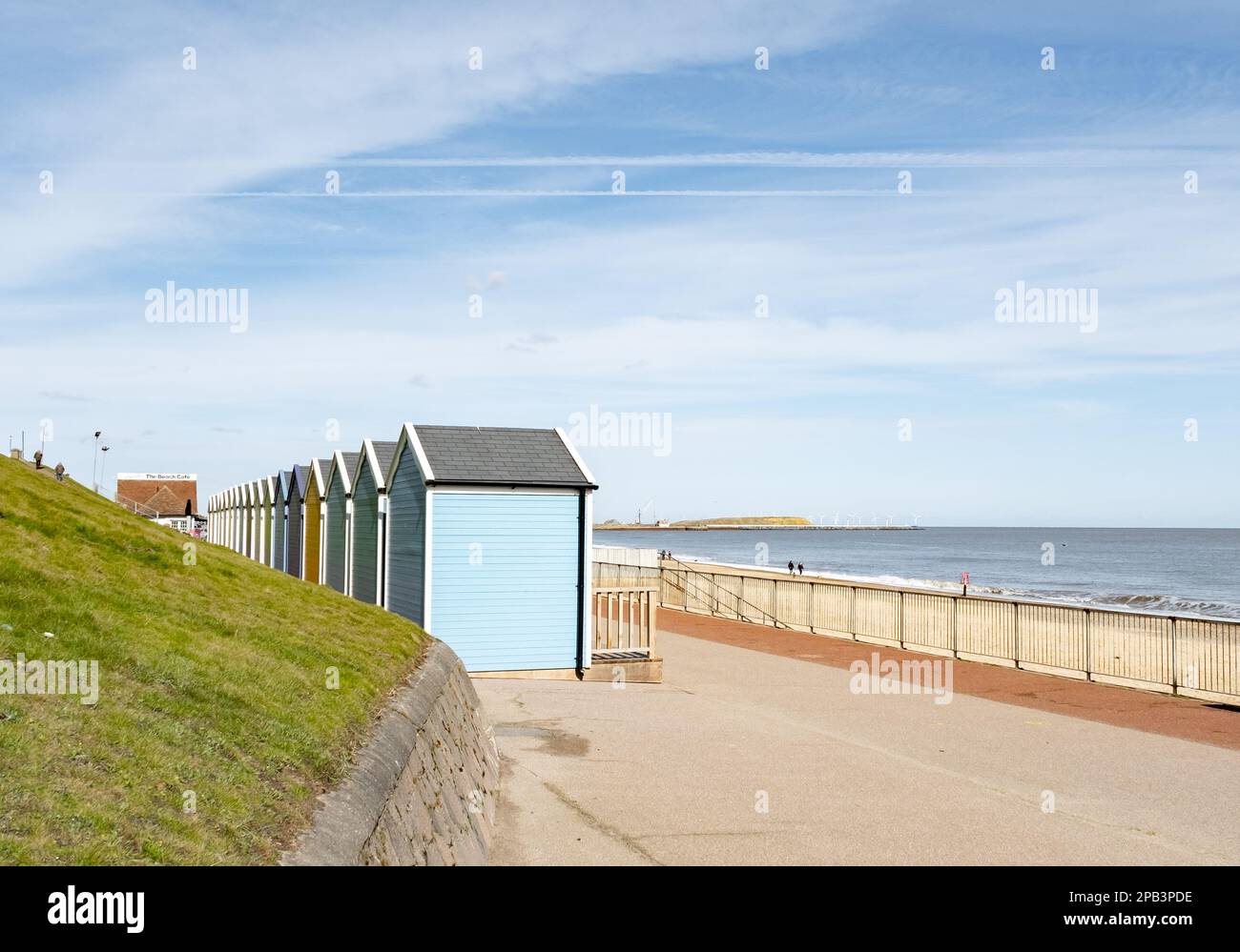 Colourful beach huts on the promenade or esplanade in the seaside town