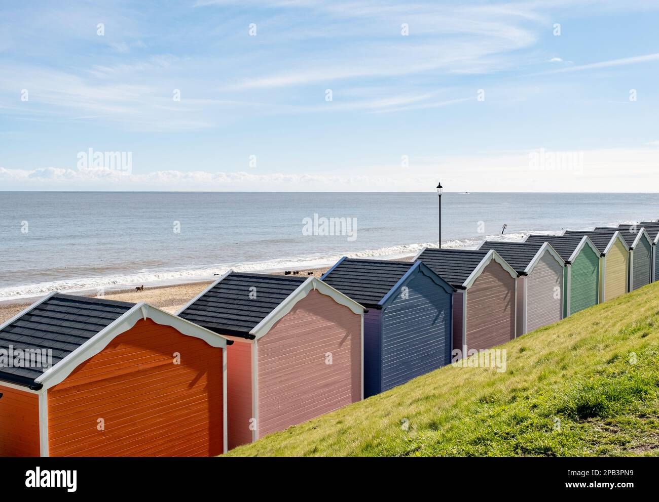 Colourful beach huts on the promenade or esplanade in the seaside town