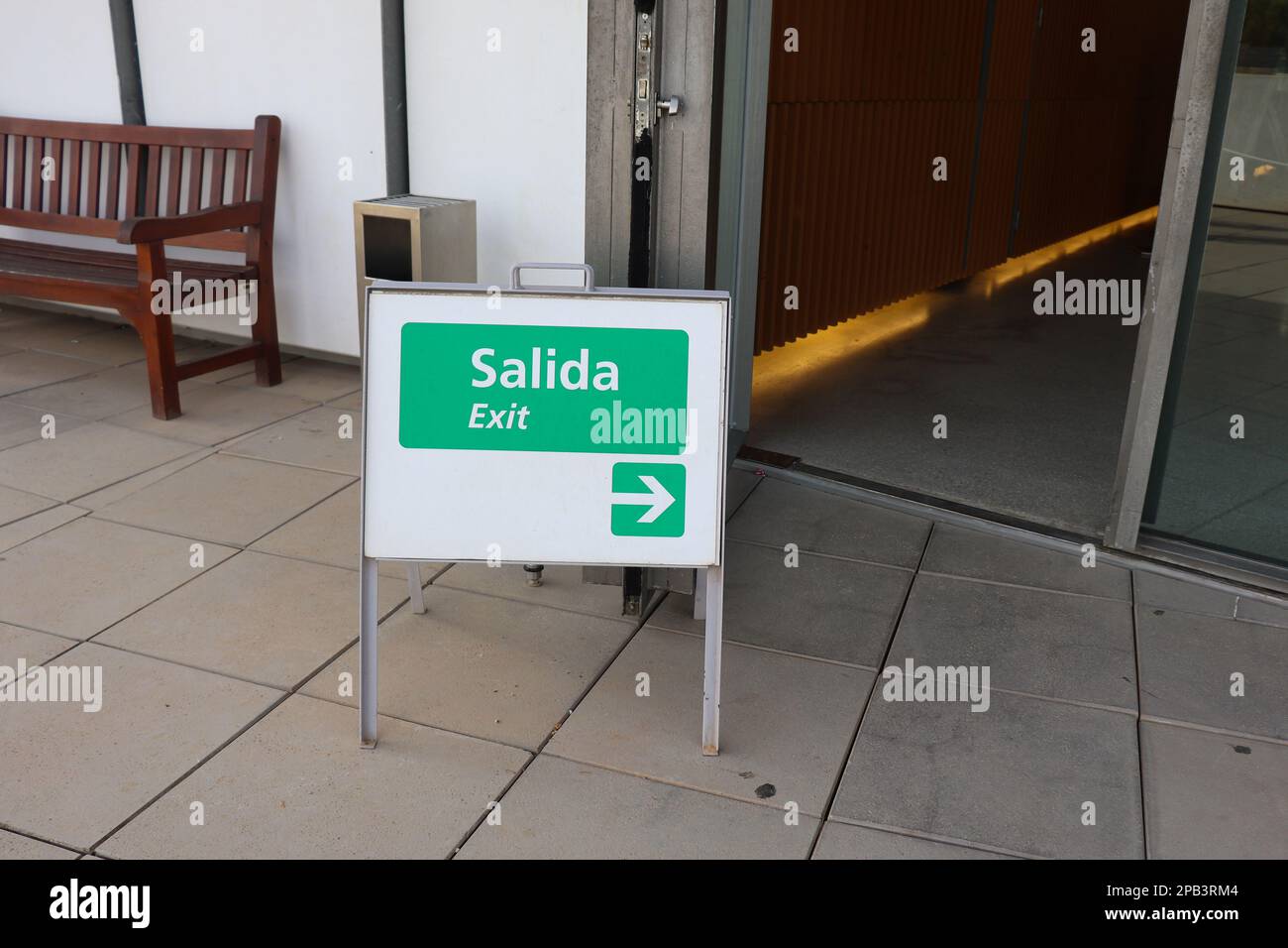 A Little Sign Board to Show Exit Way Both in English and Spanish