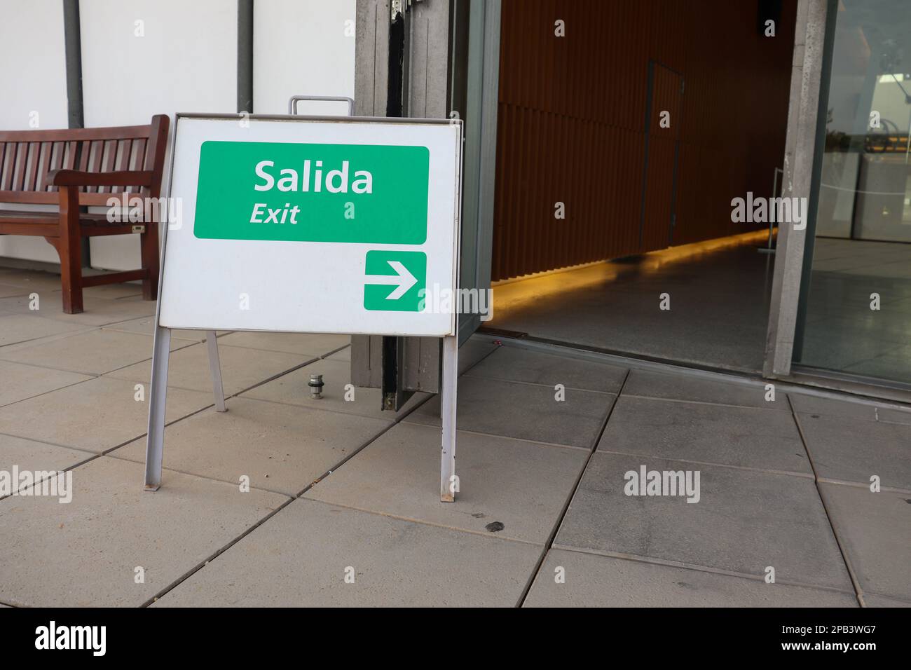 A Little Sign Board to Show Exit Way Both in English and Spanish