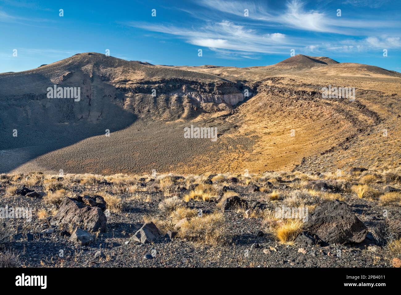 Basalt rocks on edge of volcanic caldera at Lunar Crater National Natural Landmark, Nevada, USA Stock Photo