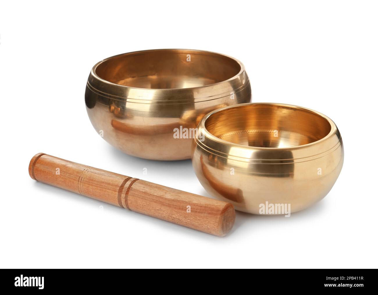 Tibetan singing bowls and wooden mallet on white background Stock Photo ...