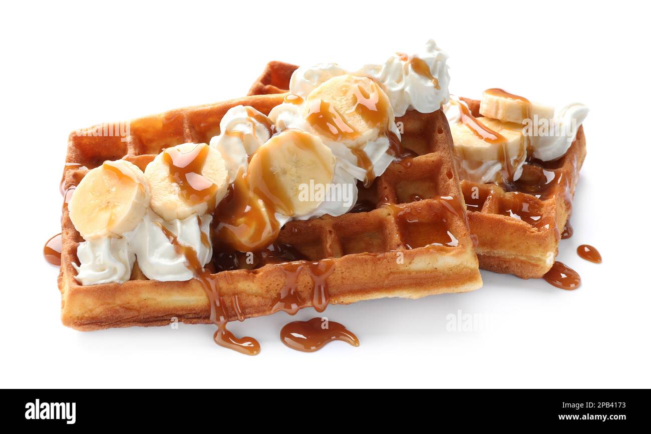 Delicious Belgian waffles with banana, whipped cream and caramel sauce ...