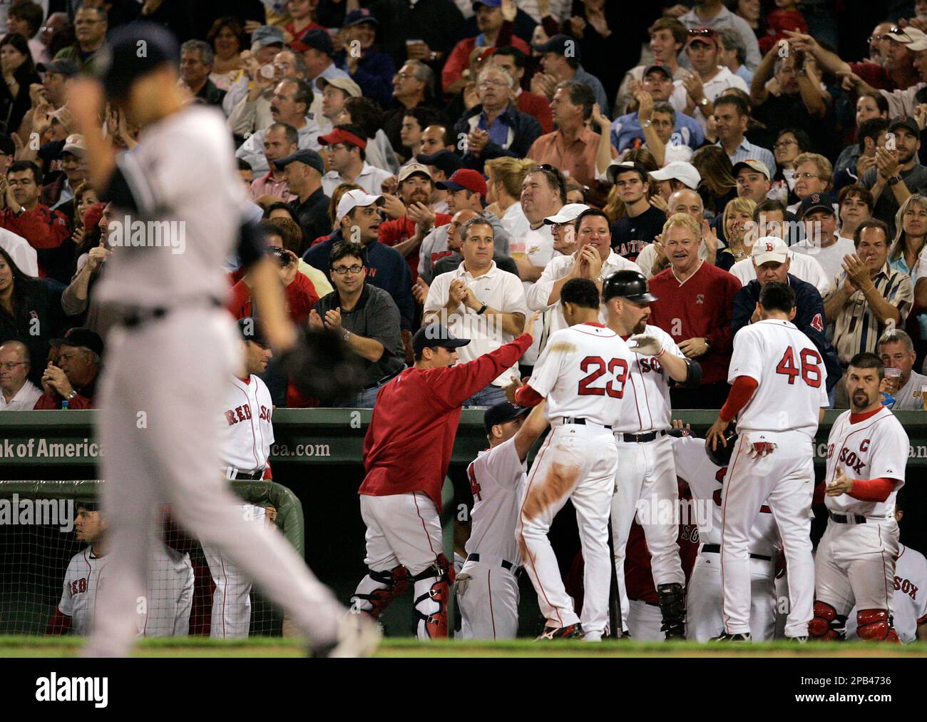 New York Yankees starting pitcher Andy Pettitte, foreground left, walks