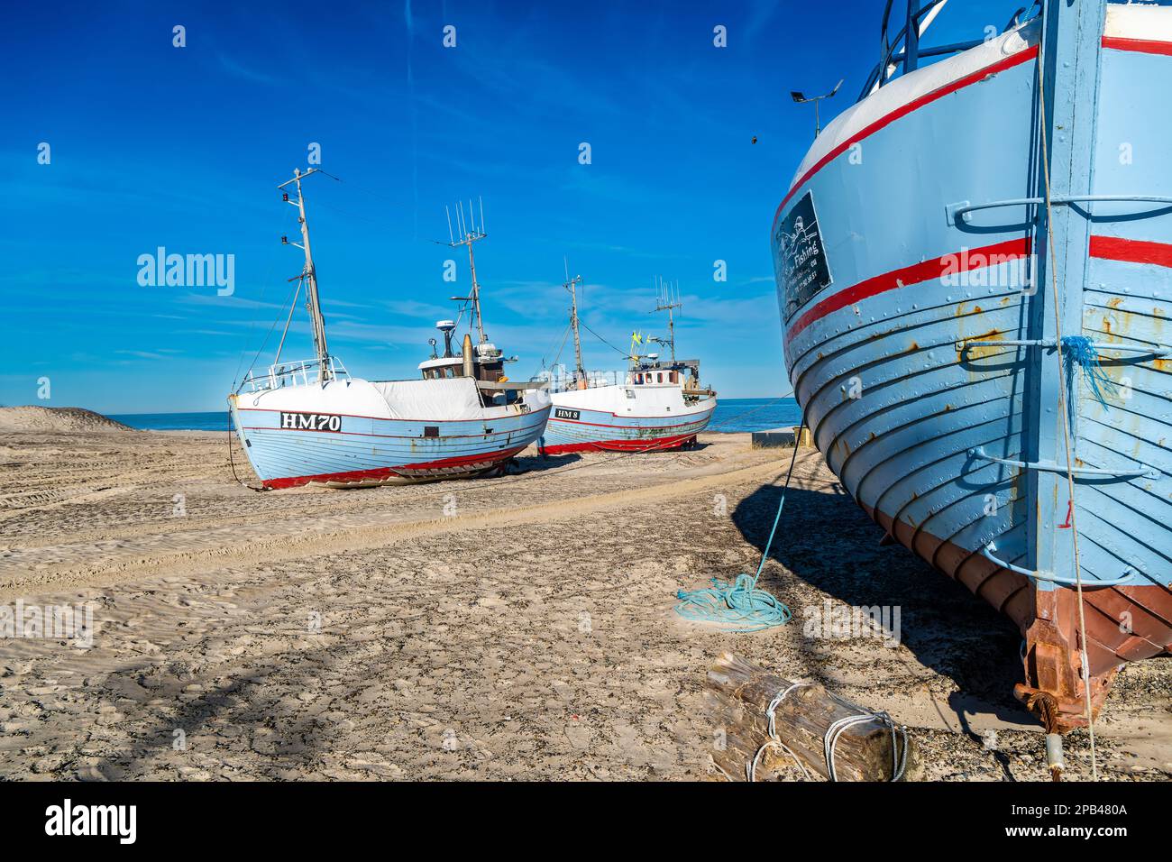 Wooden fishing vessels cutters at Thorup beach landing place in Thy