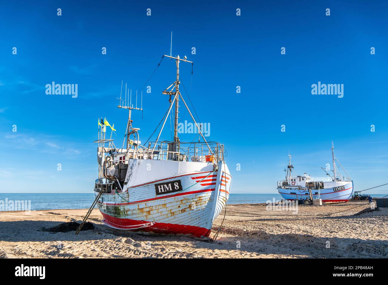 Wooden fishing vessels cutters at Thorup beach landing place in Thy