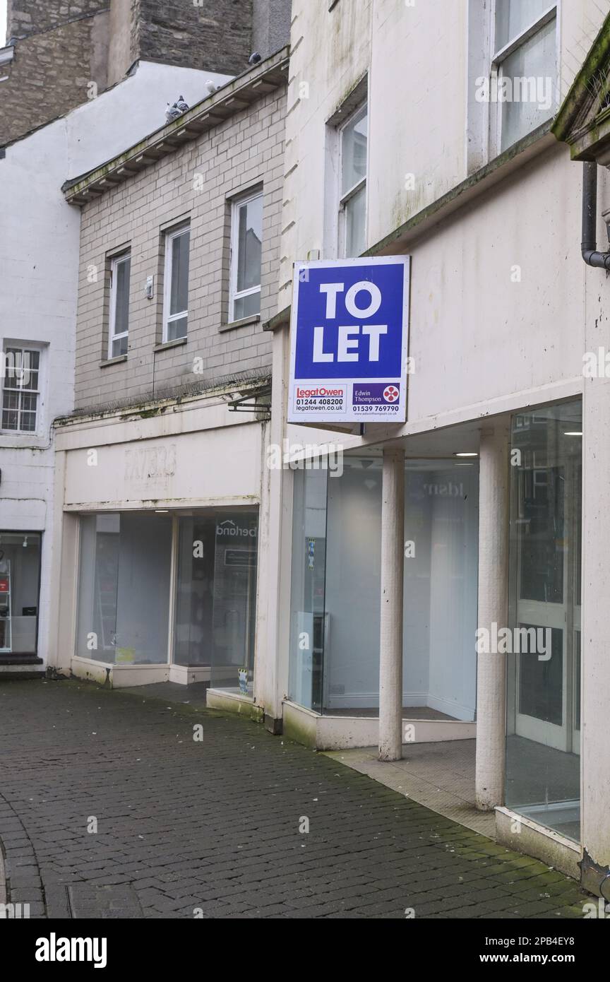 Kendal, Cumbria, 12th March 2023 - Empty and unused shops on the High Street in the North West town of Kendal in Cumbria. Several shops and businesses have closed as rents and rates increase along with a decrease of customers due to the cost of living crisis. Credit: Ben Formby/Alamy Live News Stock Photo