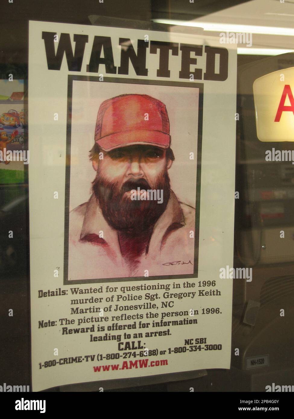 Many locals think this sketch, shown Thursday, Sept. 6, 2007, in the window  of a gas station on NC 67 in Jonesville, N.C., bears a striking resemblance  to Adam Leroy Lane. Police