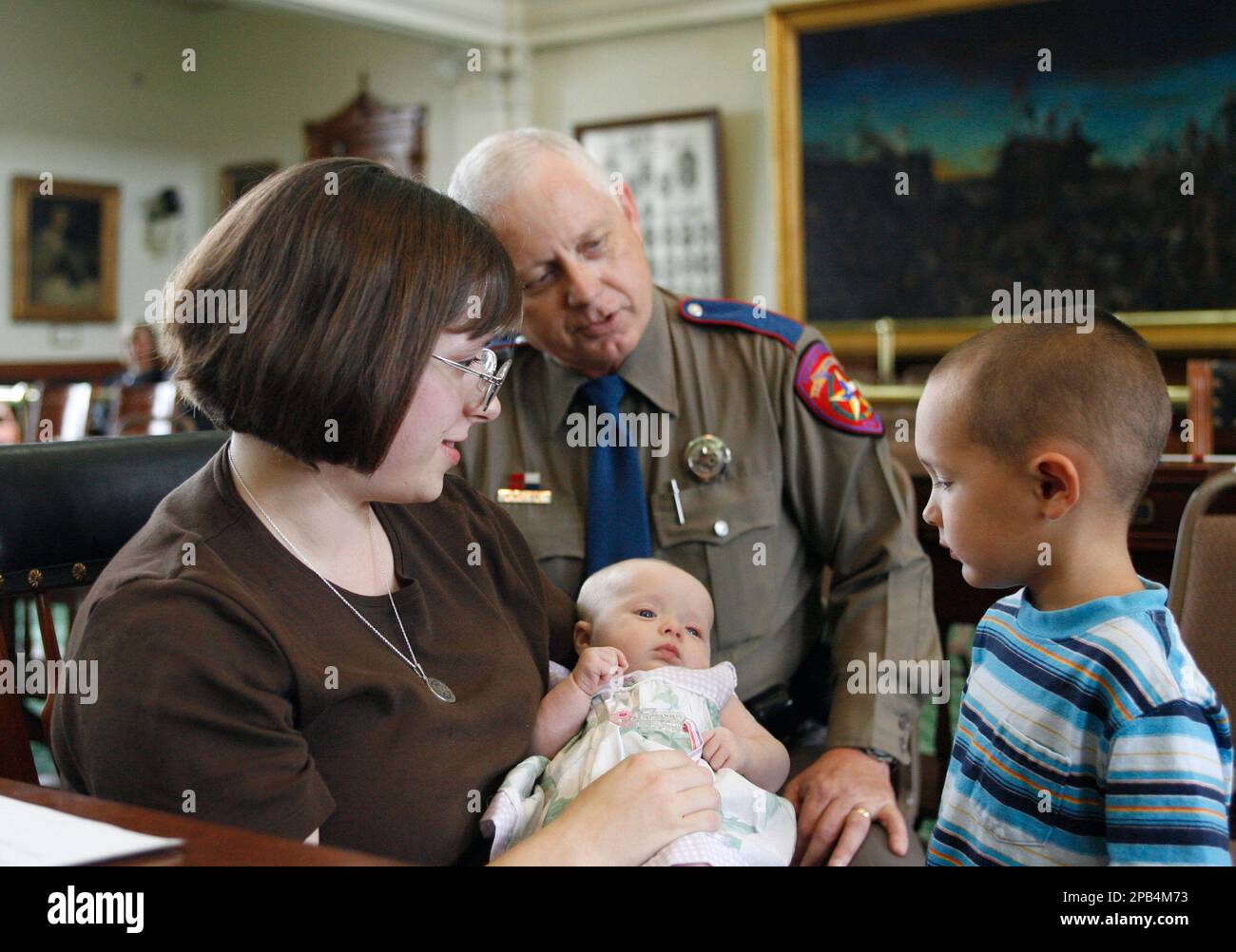 Stephanie Holmes, left, widow of slain Texas Department of Safety