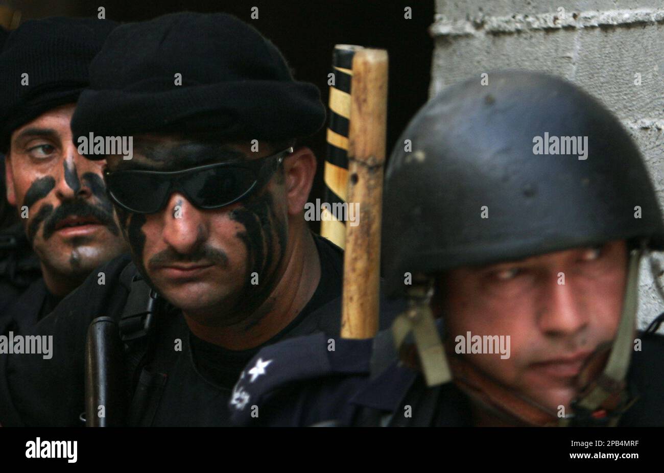 Palestinian security forces loyal to President Mahmoud Abbas stand in ...