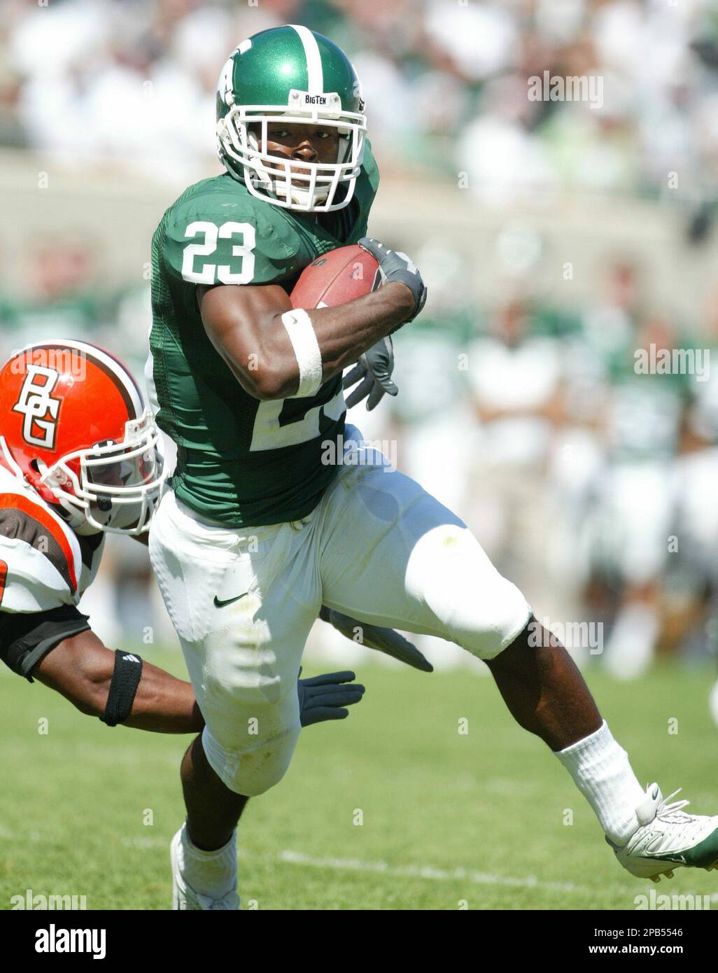 Michigan State's Javon Ringer (23) runs for a first-quarter 4-yard  touchdown around Bowling Green's Loren Hargrove during a football game  Saturday, Sept. 8, 2007, in East Lansing, Mich. (AP Photo/Al Goldis Stock