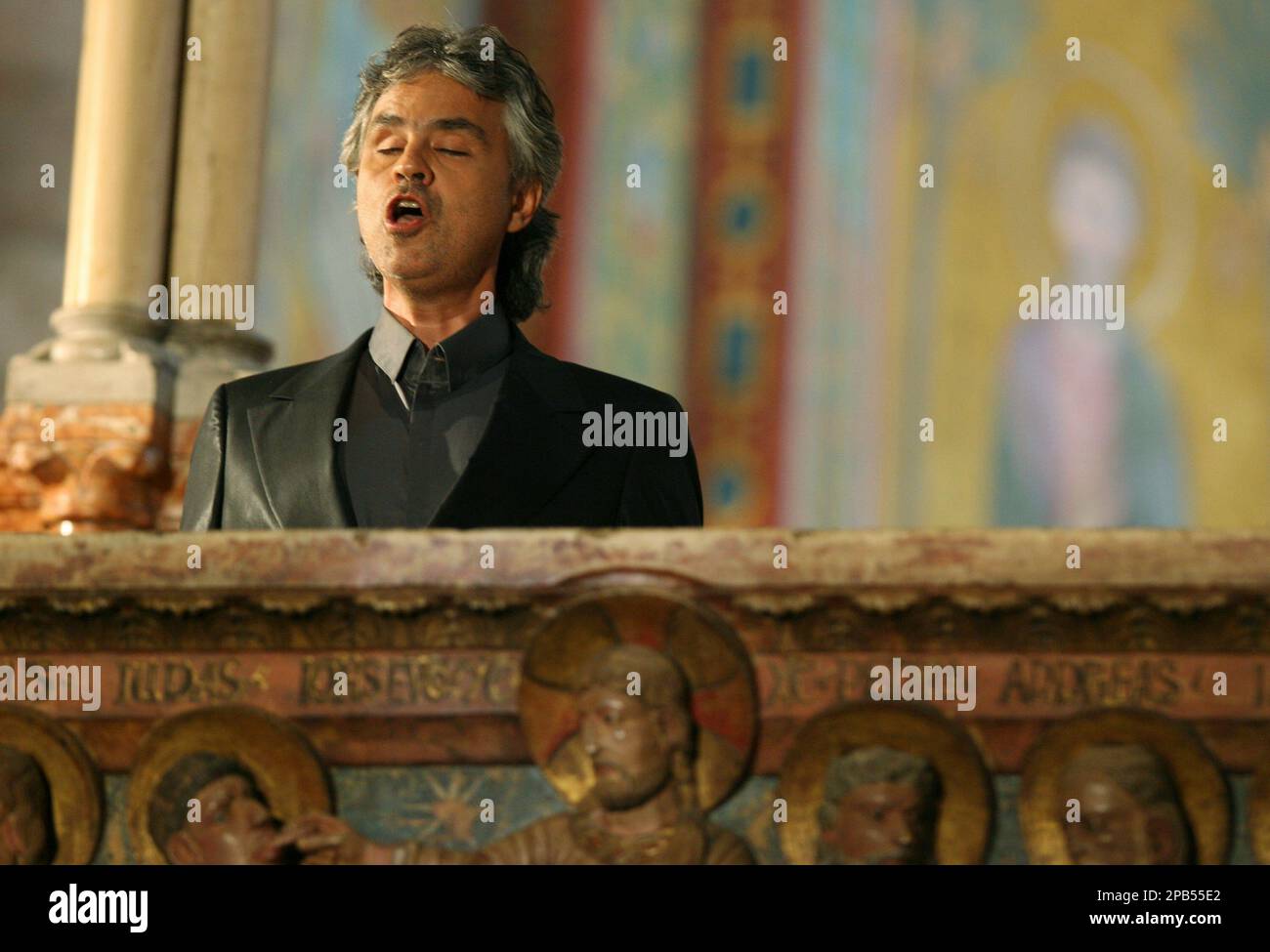 Italian tenor Andrea Bocelli sings during Italian tenor Luciano