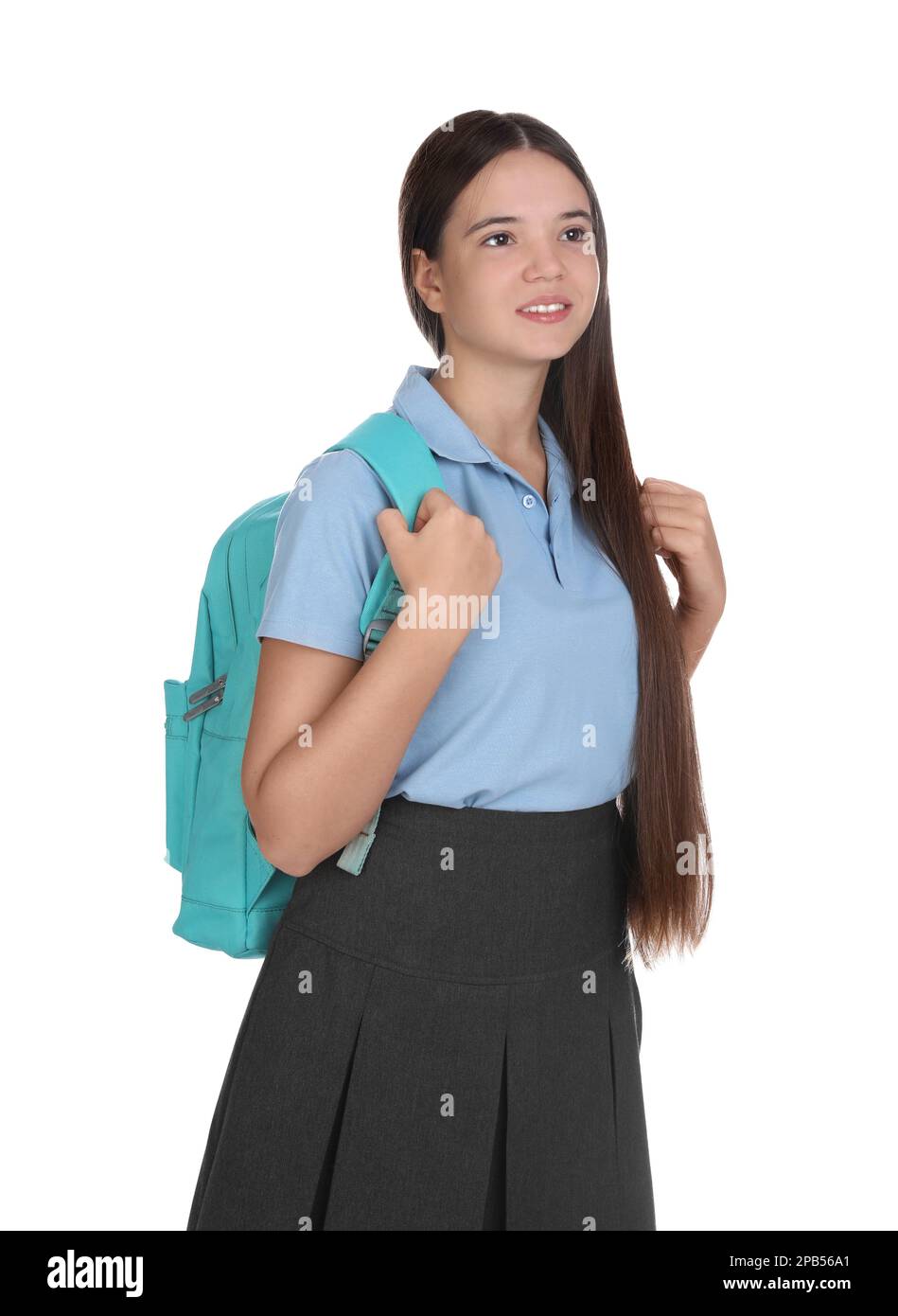 Teenage girl in school uniform with backpack on white background Stock