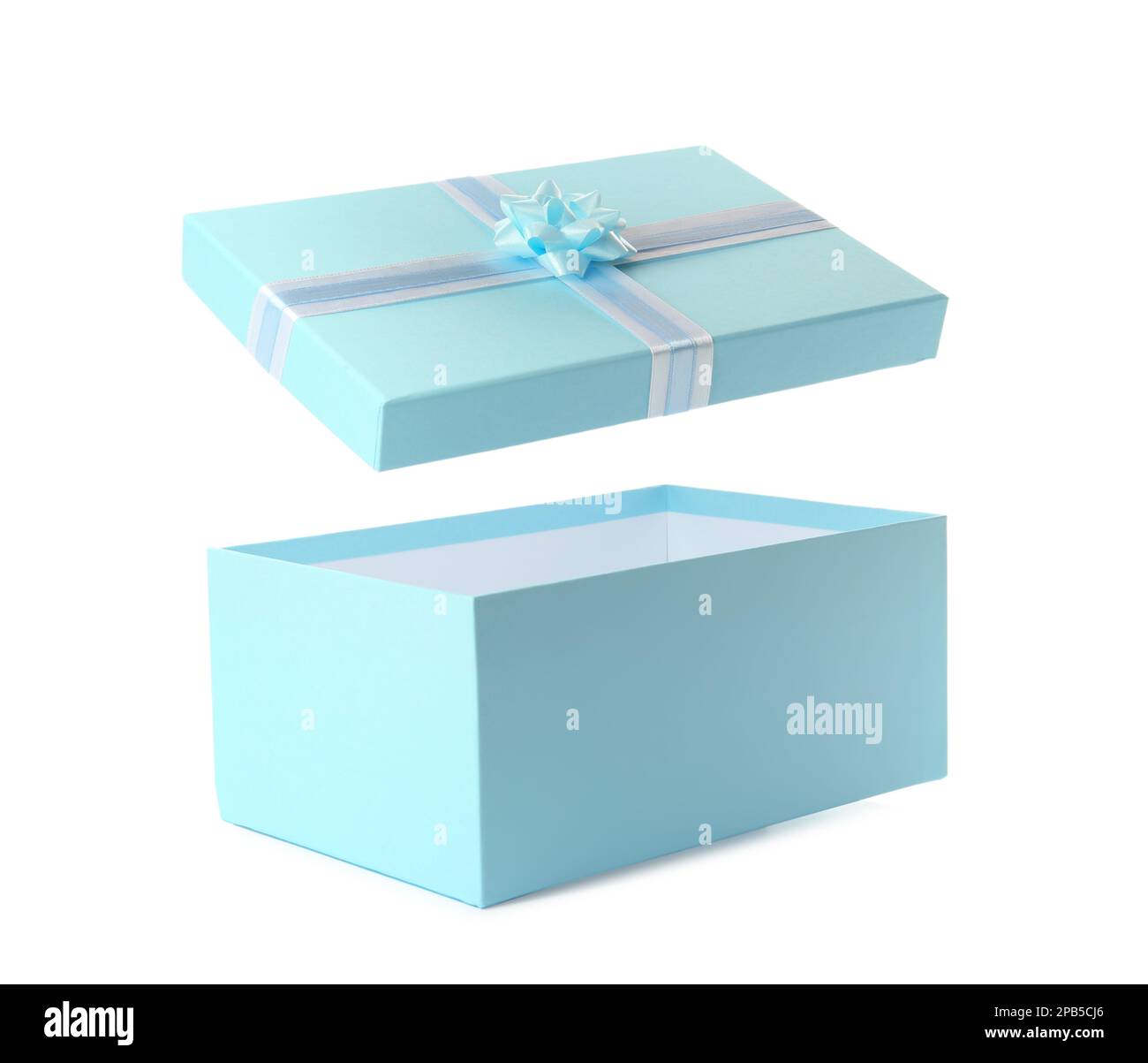 Light blue gift box and lid with bow on white background Stock Photo