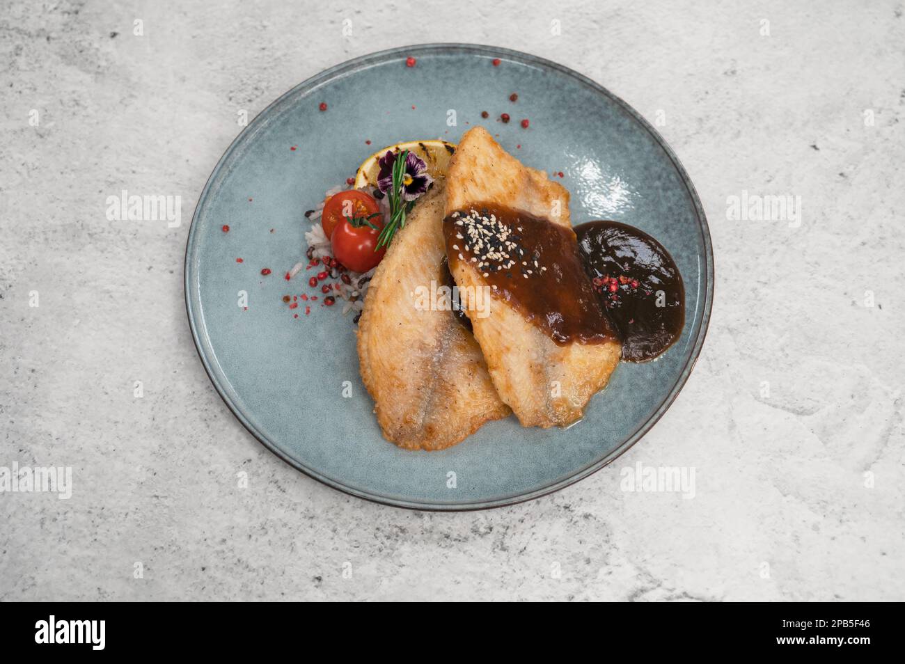 Fried tilapia fish with rice sauce and vegetable Stock Photo Alamy