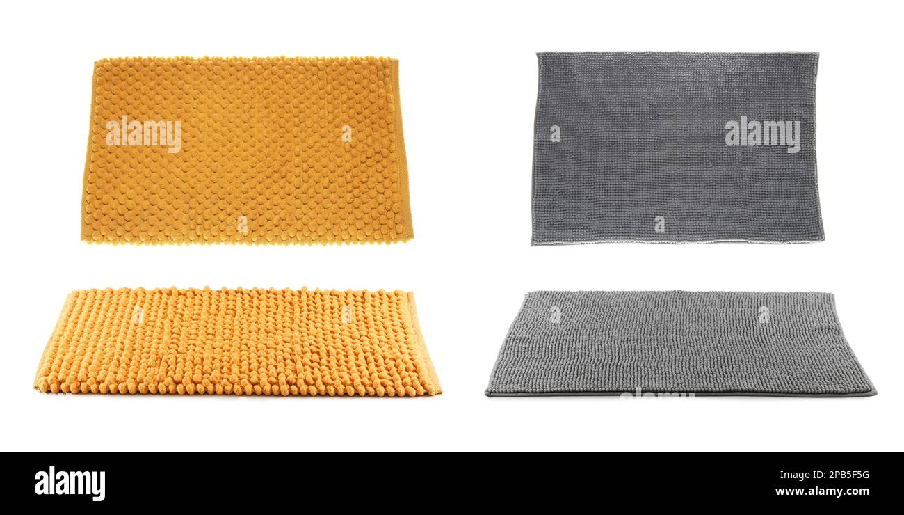 Set with soft bath mats on white background Stock Photo Alamy