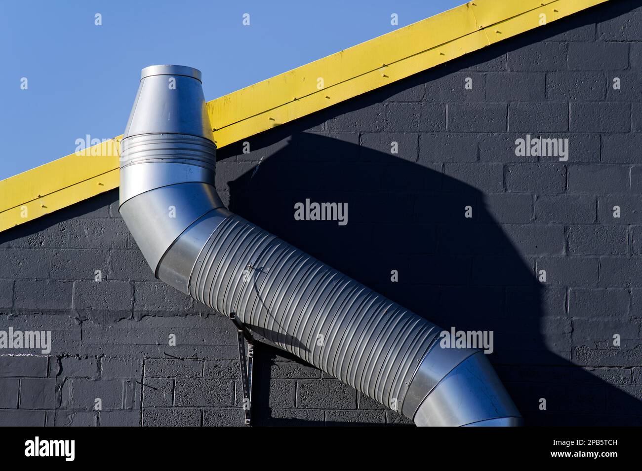 Flue chimney fixed to building exterior wall stainless steel from