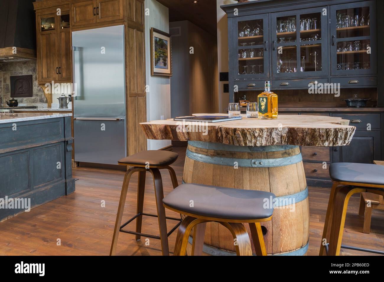 Stained cherry wood whiskey barrel bar with barstools and