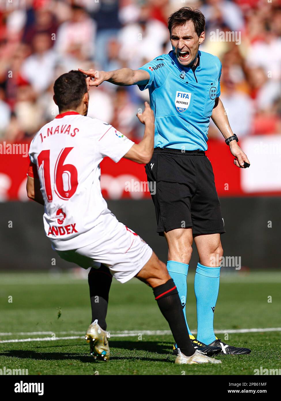 The referee Ricardo de Burgos Bengoetxea and Jesus Navas of Sevilla FC  during the La Liga match between Sevilla FC and UD Almeria played at Sanchez Pizjuan Stadum on March 12, 2023 in Sevilla, Spain. (Photo by Antonio Pozo / PRESSIN) Stock Photo