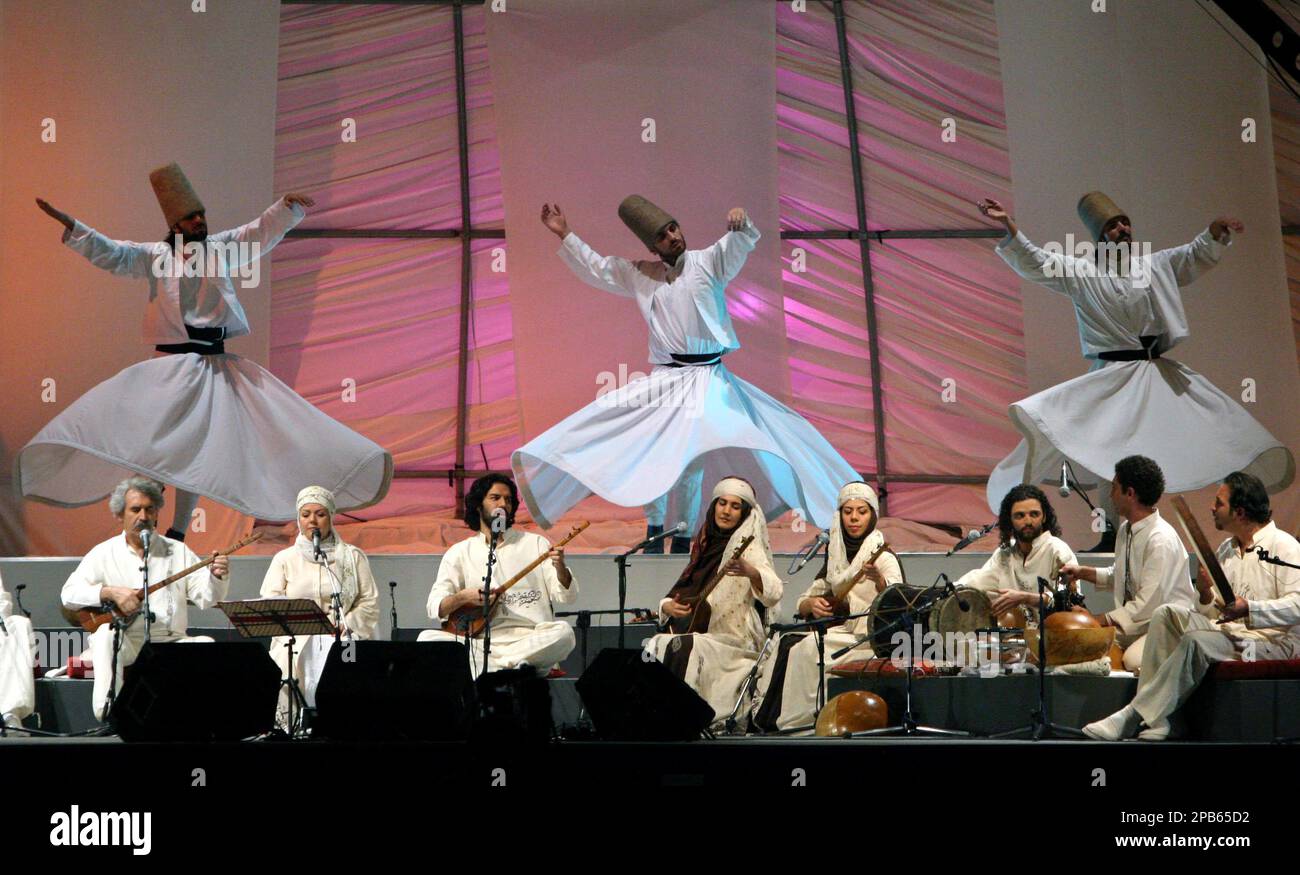 Iranian musicians perform with Turkish Sema Sufi dancers during a