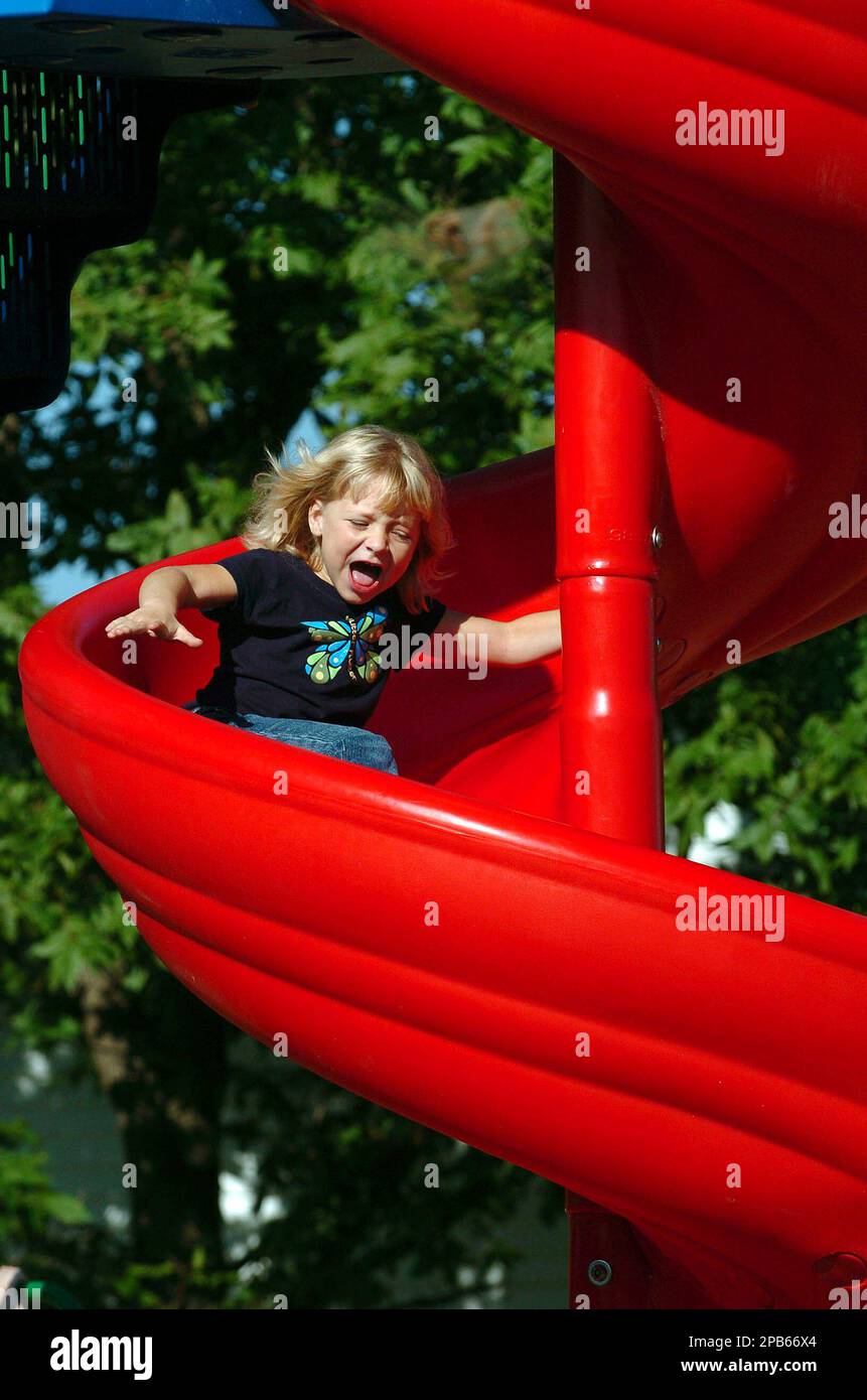 Trinity Hilderbrand, 7, yells as she takes her first ride Friday, Aug
