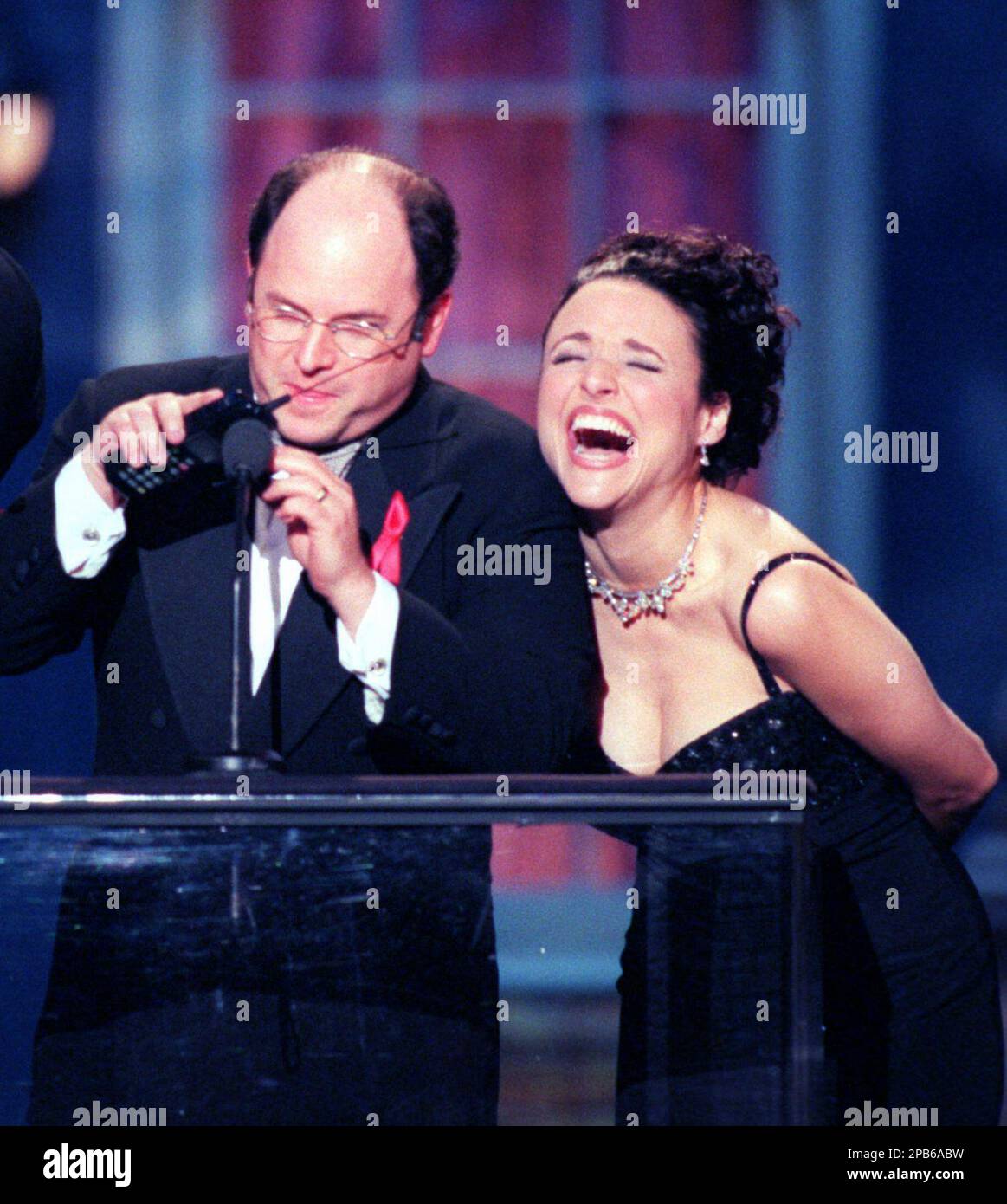 **FILE**Jason Alexander attempts to telephone Jerry Seinfeld as he and