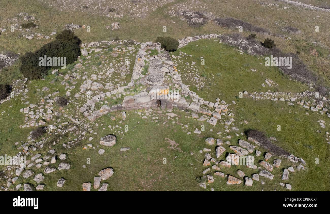 Archeological ruins of Nuragic necropolis Giants Tomb of S’omu de S’orcu - Tomba di Giganti Omu de Orcu - with front grave stones of Neolithic cemeter Stock Photo