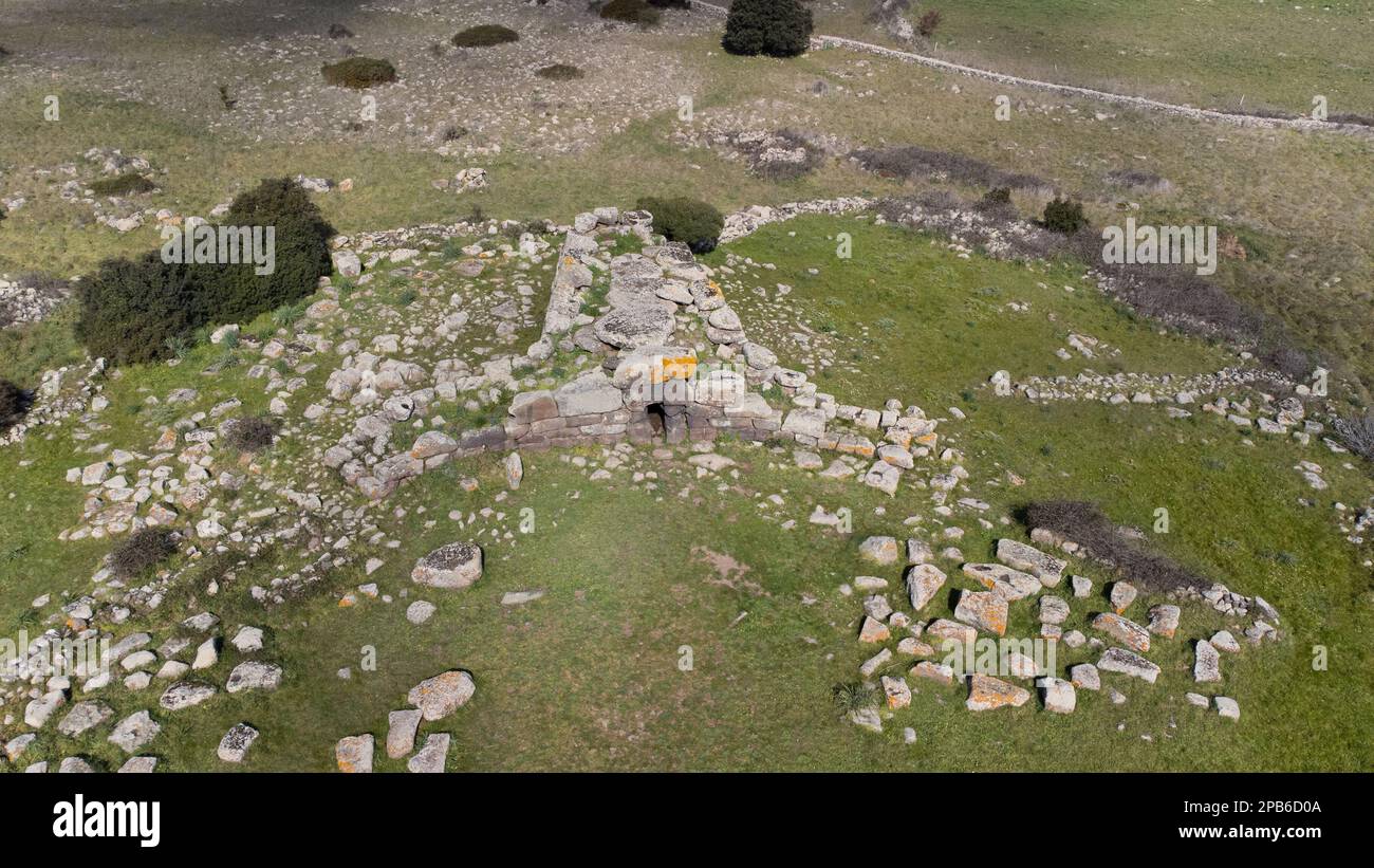 Archeological ruins of Nuragic necropolis Giants Tomb of S’omu de S’orcu - Tomba di Giganti Omu de Orcu - with front grave stones of Neolithic cemeter Stock Photo