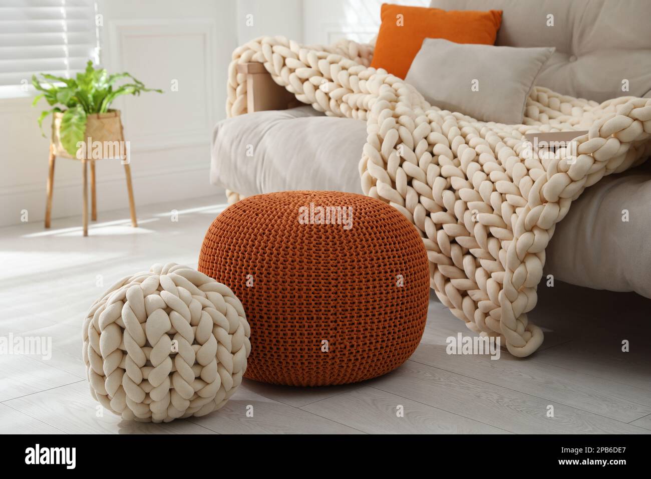 Stylish comfortable poufs in room. Home design Stock Photo Alamy