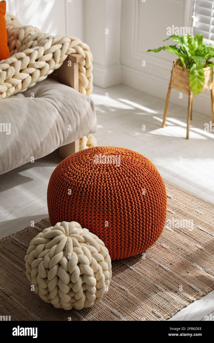 Stylish comfortable poufs in room. Home design Stock Photo Alamy
