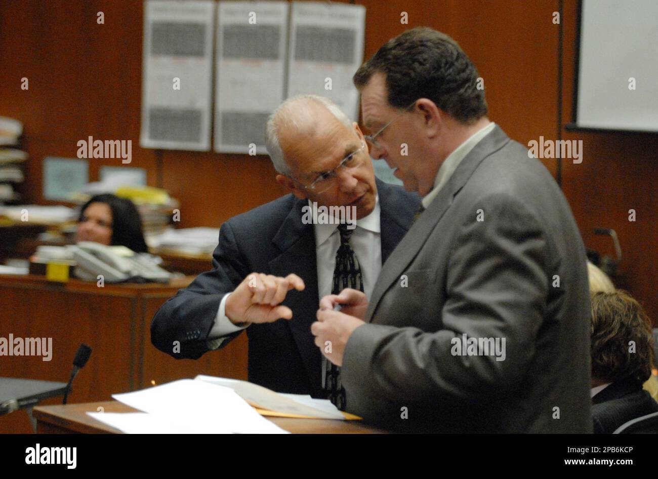 Defense attorneys Roger Rosen, left, and Christopher Plourd discuss ...
