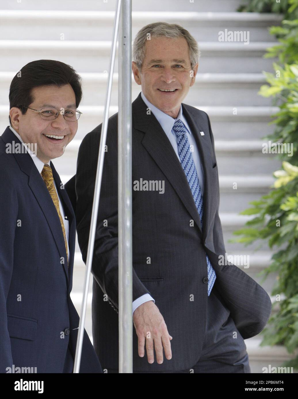 **FILE** President Bush, right, walks with Attorney General Alberto Gonzales outside of the White House in Washington in this Thursday, Aug. 9, 2007 file photo. Bush administration officials say Gonzales will announce his resignation Monday, Aug. 27, 2007. (AP Photo/Ron Edmonds, FILE) Stock Photo